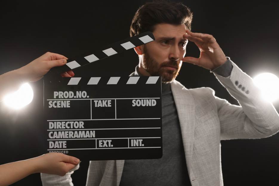 A person holding a movie clapper board

AI-generated content may be incorrect.